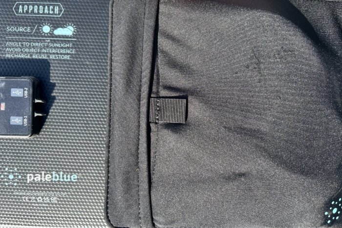 a pocket on a pale blue earth solar panel
